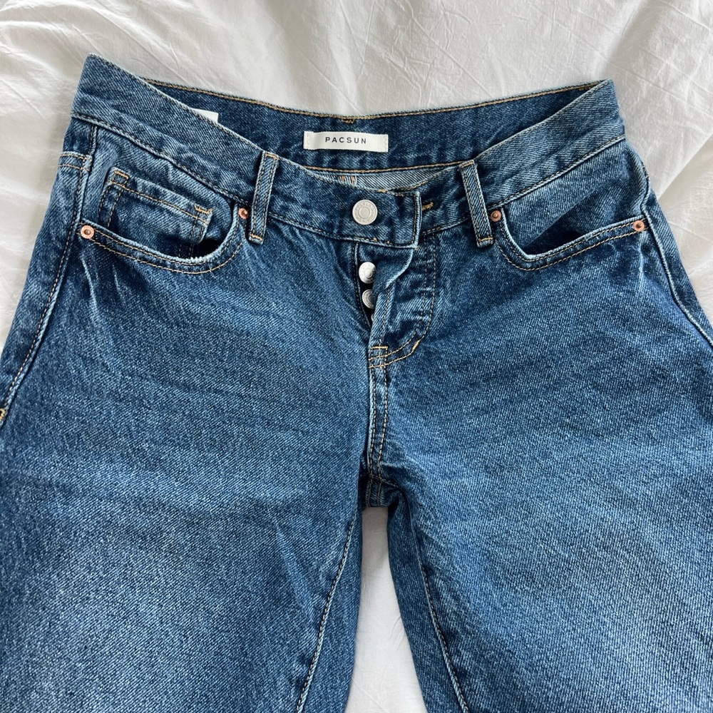 size 23 low rise pacsun dark wash jeans, with boot cut open slit.